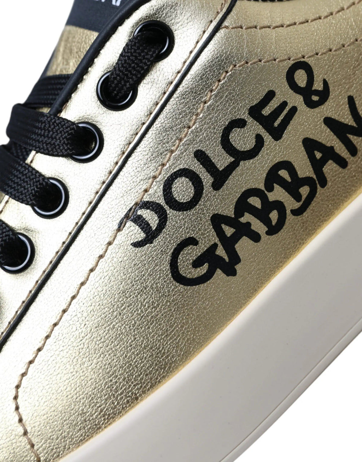Baskets dolce gabbana portofino en cuir de veau doré avec lacets noirs et logo calligraphié sur le côté