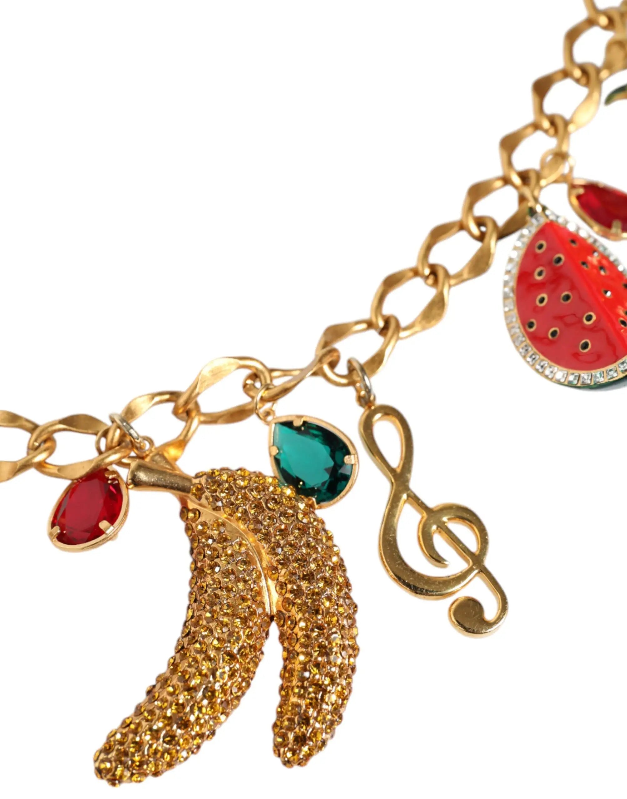 Bracelet charm couleur or avec banane scintillante, pierres rouges et vertes, et pendentif note de musique dolce & gabbana