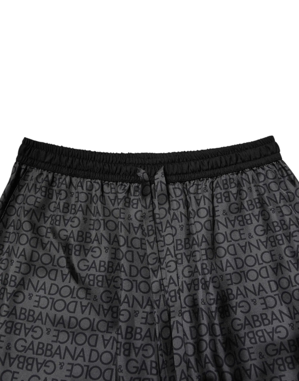 Joggers noirs dolce gabbana avec logo imprimé et taille élastique dans une tenue bermuda en soie grise et noire hommes