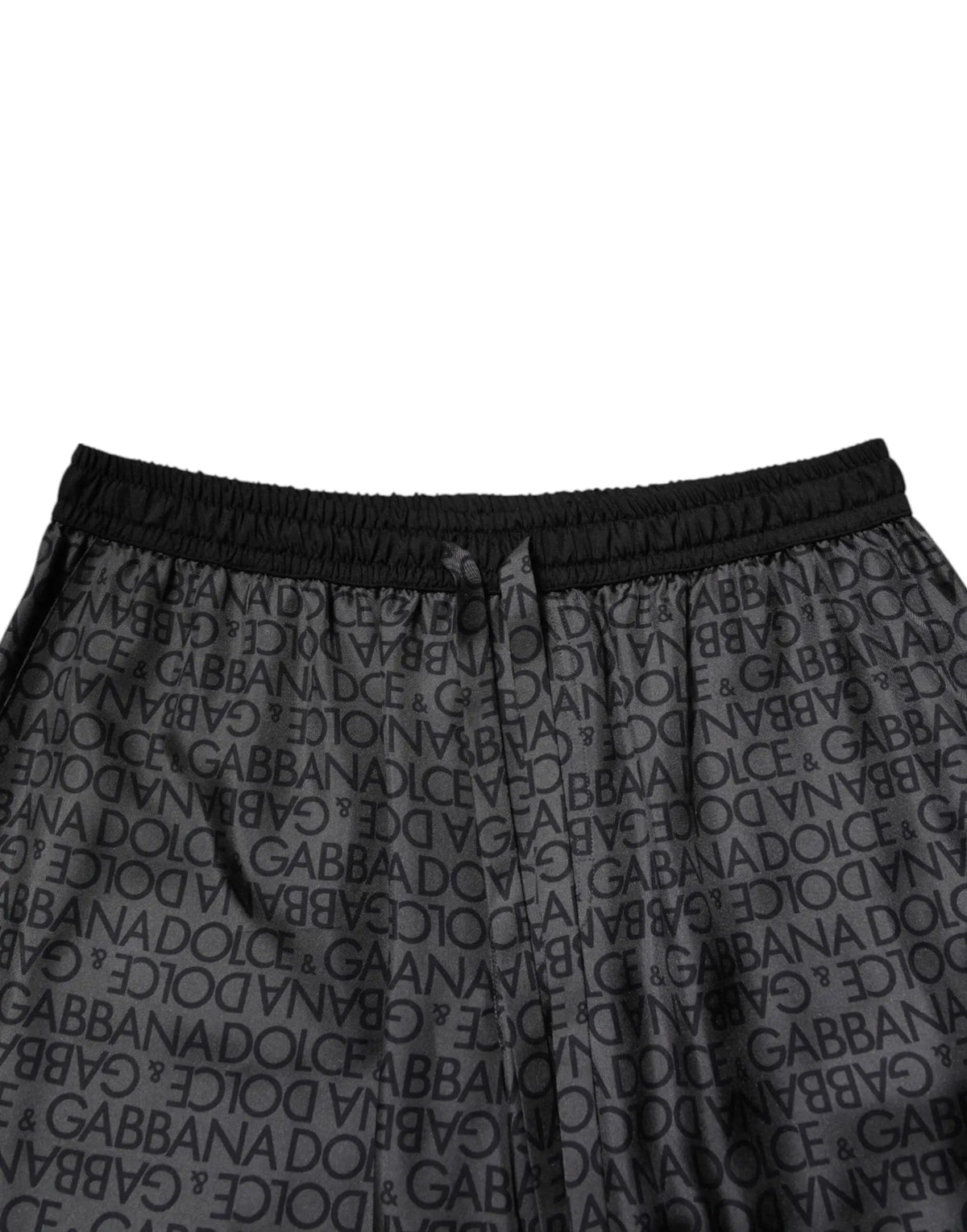 Joggers noirs dolce gabbana avec logo imprimé et taille élastique dans une tenue bermuda en soie grise et noire hommes