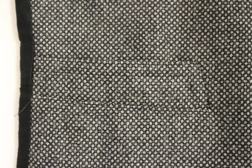 Tissu noir à motifs de petits points blancs pour la veste sans manches dolce & gabbana en mélange coton gris