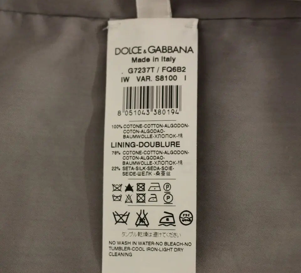 Étiquette de soin en tissu blanc pour un gilet robe gris slim en coton dolce & gabbana avec instructions multilingues