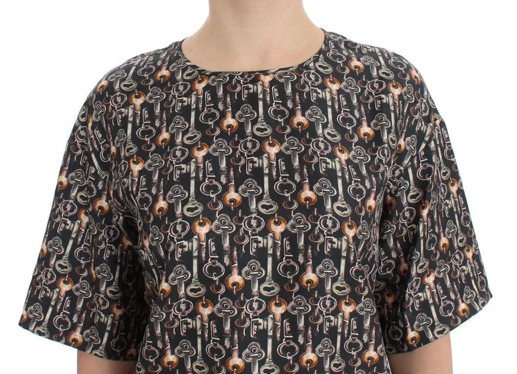 Blouse dolce & gabbana en soie noire avec motif répétitif de clés vintage gris et doré
