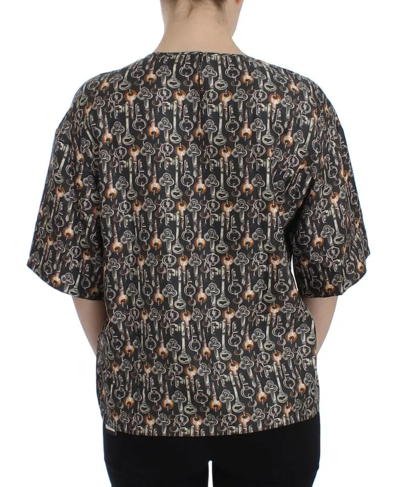 Blouse noir dolce & gabbana en soie avec motif de clés vintage en tons métalliques argent et bronze chaud