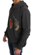 Pull dolce & gabbana gris foncé avec capuche orné d’un patch revolver et cœur détaillé avec clous dorés
