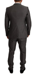 Un costume slim fit dolce & gabbana martini gris métallique en tissu texturé avec coupe ajustée et revers classiques