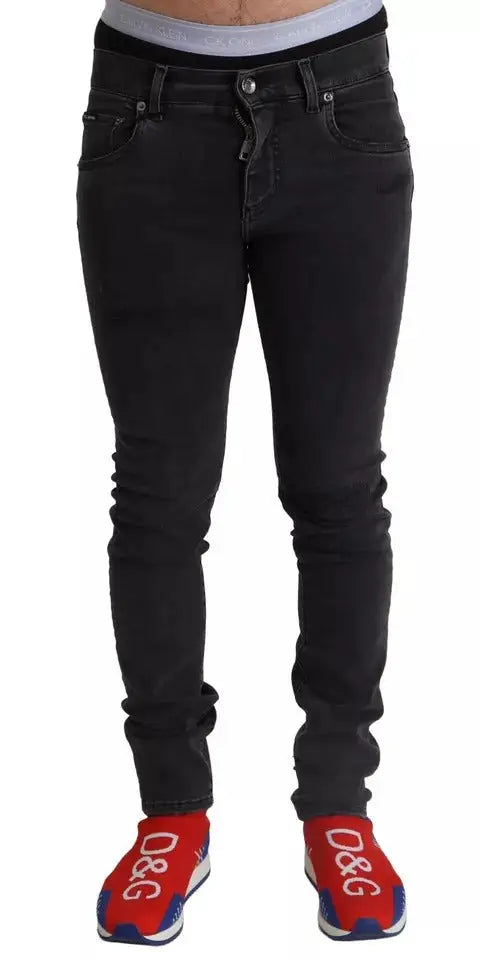 Dolce & gabbana gray running denim stretch skinny jeans en jean noir slim avec effet délavé subtil et cinq poches classiques