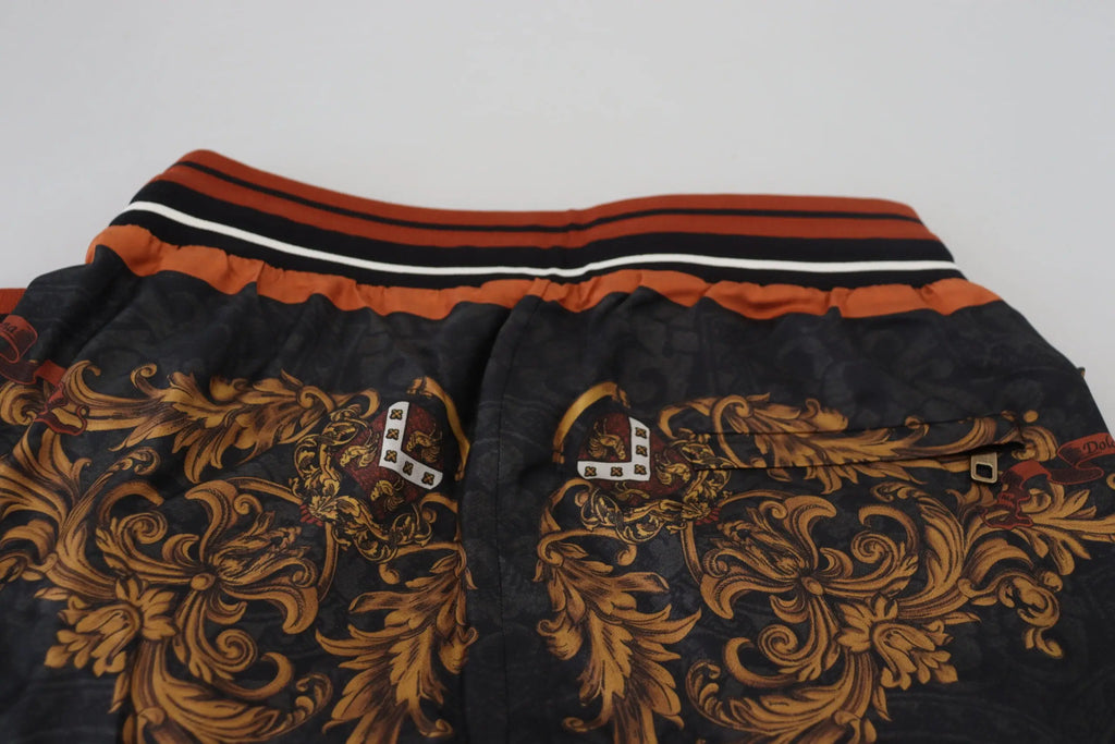 Shorts noirs dolce gabana en soie avec motif baroque orné et taille élastique rayée orange