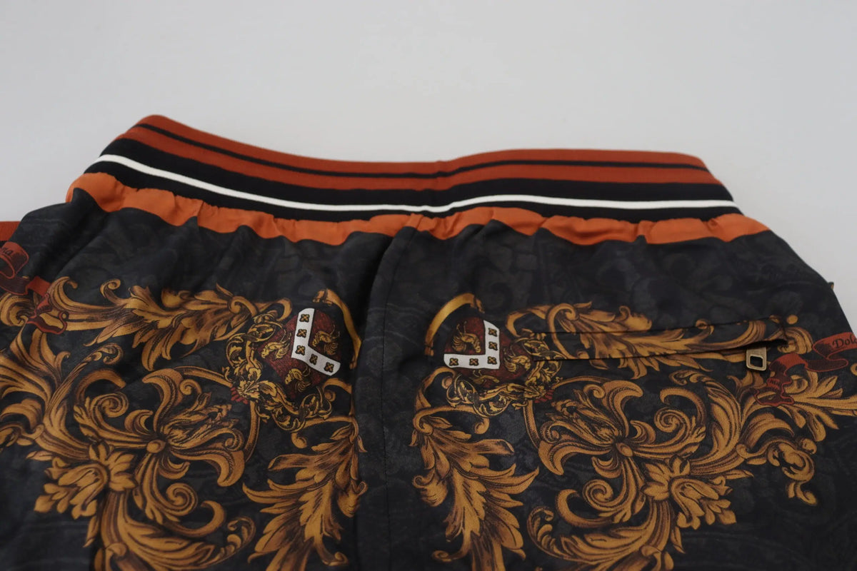 Shorts noirs dolce gabana en soie avec motif baroque orné et taille élastique rayée orange