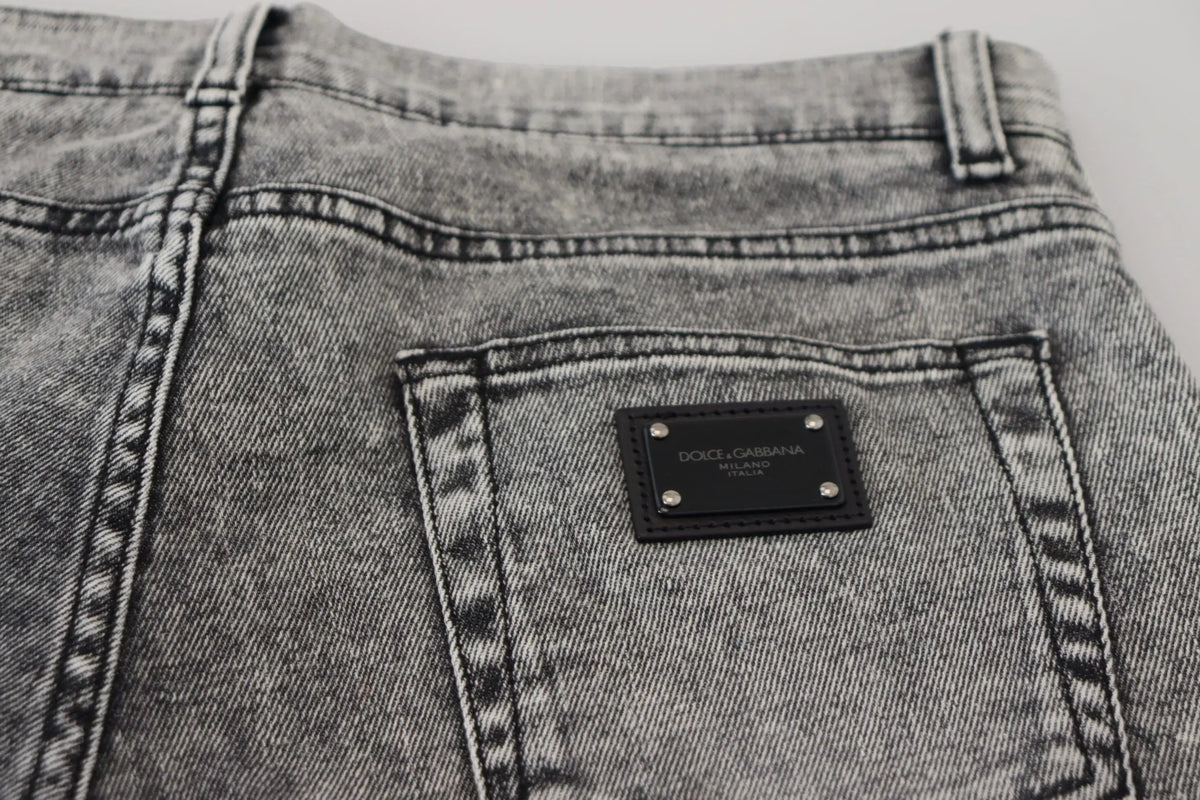 Jeans en denim gris dolce & gabbana slim fit avec patch cuir noir et couture argentée au dos