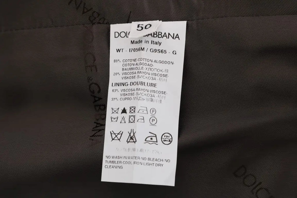 Étiquette blanche rectangulaire avec texte et symboles noirs dolce & gabbana composition coton gilet rayé gris made in italy