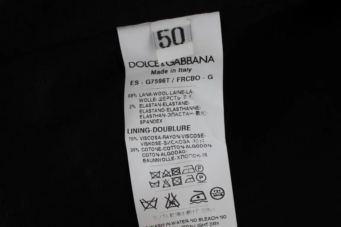Étiquette d’entretien blanche dolce & gabbana avec texte et symboles noirs pour gilet formel rayé gris