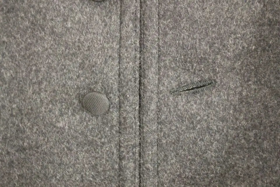 Dolce & gabbana gilet veste gris en laine mélangée avec tissu texturé légèrement moucheté et bouton gris assorti