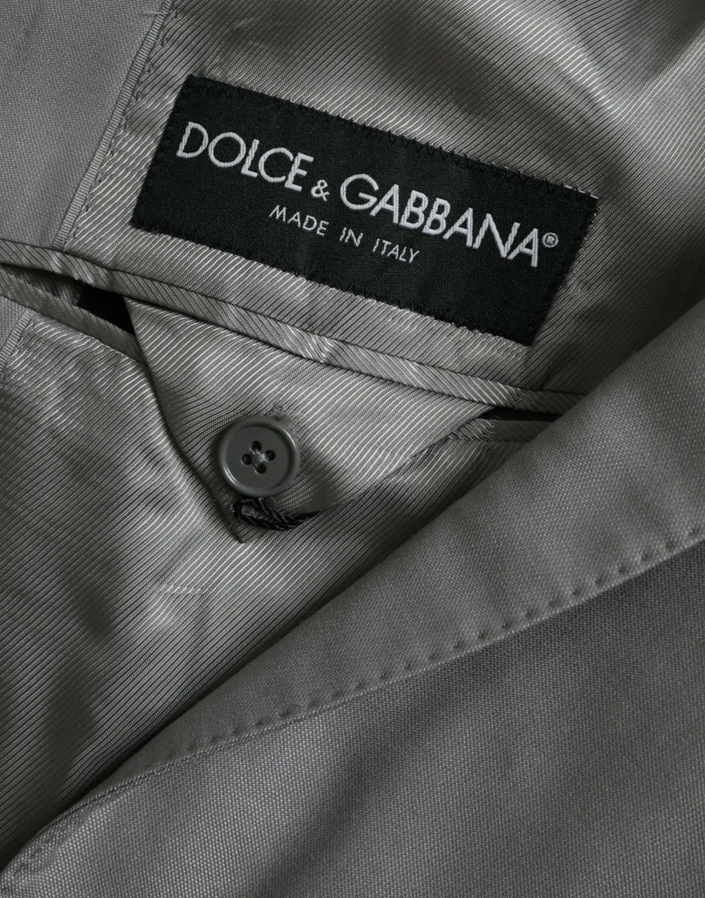 Manteau blazer gris dolce & gabbana en laine avec texture côtelée subtile et étiquette noire de marque