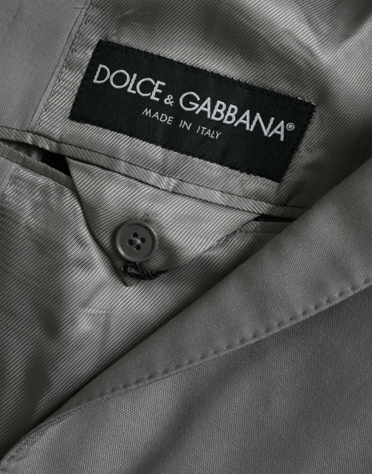 Manteau blazer gris dolce & gabbana en laine avec texture côtelée subtile et étiquette noire de marque