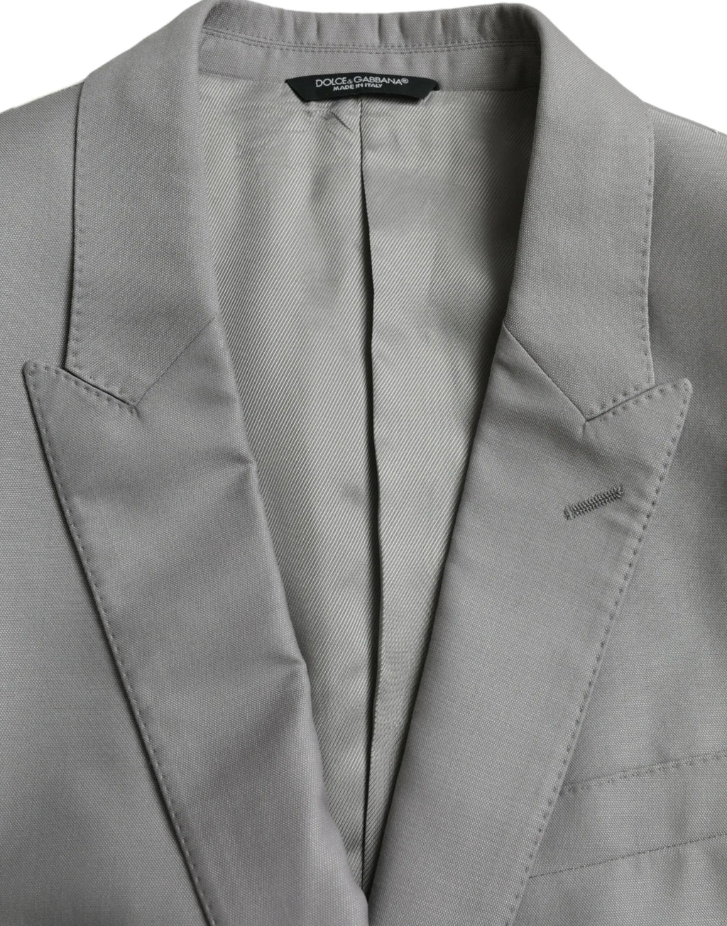 Dolce & gabbana blazer gris en laine avec tissage subtil et revers taillés net pour un style élégant