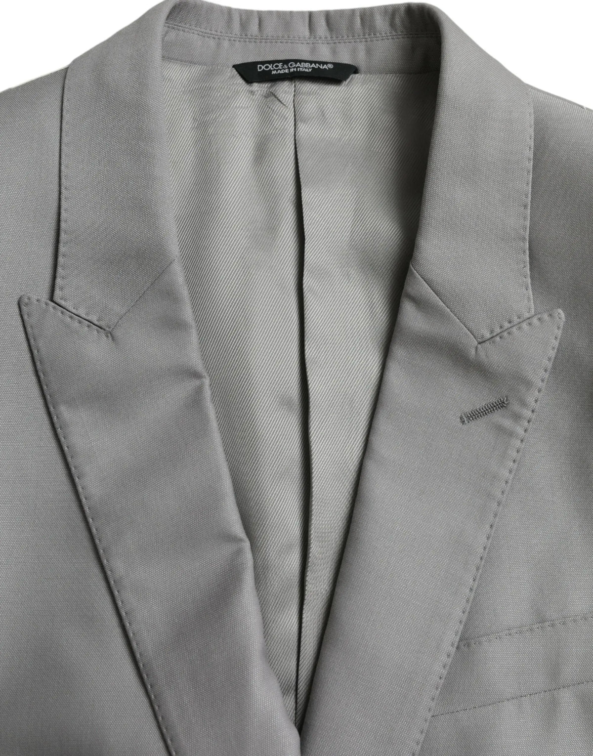 Dolce & gabbana blazer gris en laine avec tissage subtil et revers taillés net pour un style élégant