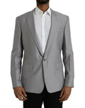 Un blazer dolce & gabbana gris clair en laine avec une texture subtile et une coupe classique simple boutonnage