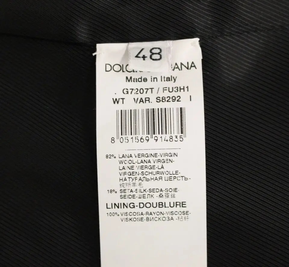 Étiquette blanche avec texte noir indiquant un gilet dolce & gabbana gris en laine vierge 82 pour cent et soie 18 pour cent fabriqué en italie