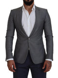 Veste blazer slim fit dolce & gabbana grise en laine et soie avec fermeture à un bouton et revers crantés portée sur chemise blanche