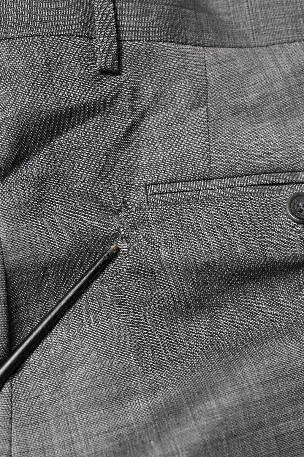 Pantalon en laine grise à texture herringbone avec fermeture à bouton unique dolce & gabbana