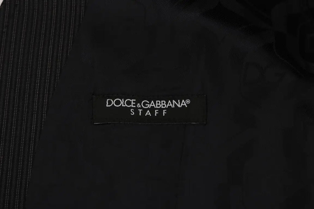 Étiquette noire dolce & gabbana brodée en blanc sur un gilet gris en laine stretch homme