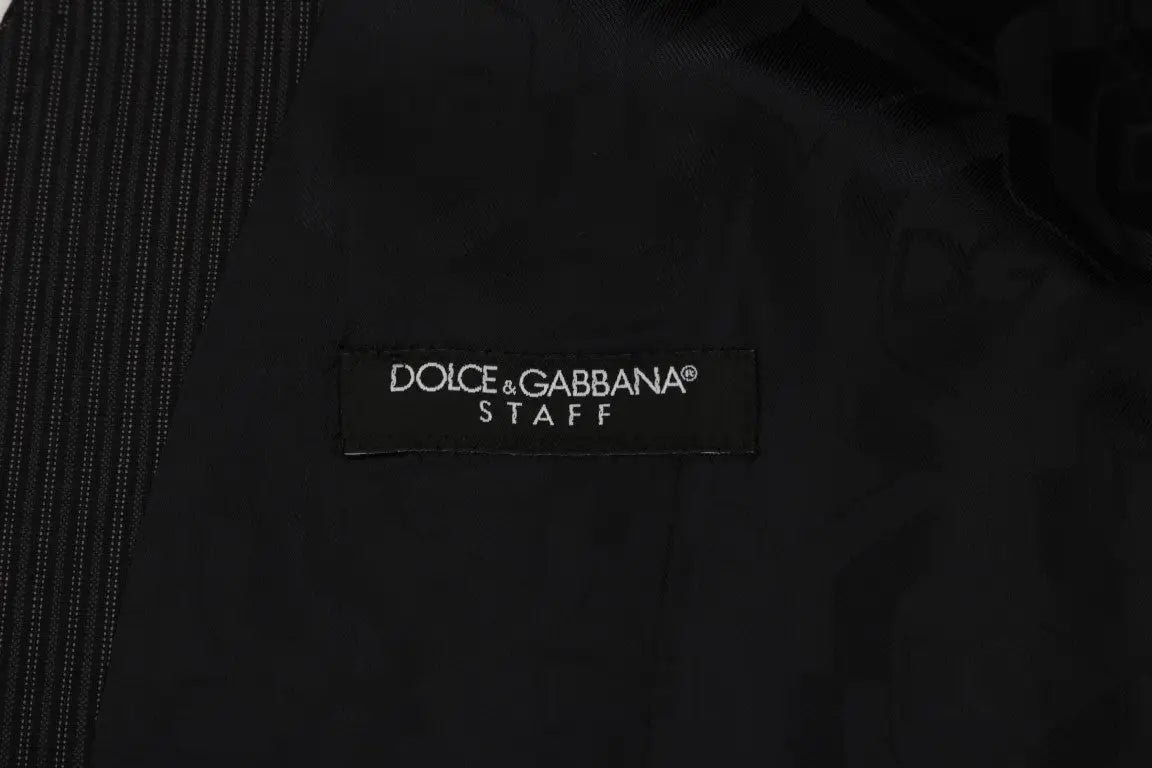 Étiquette noire dolce & gabbana brodée en blanc sur un gilet gris en laine stretch homme