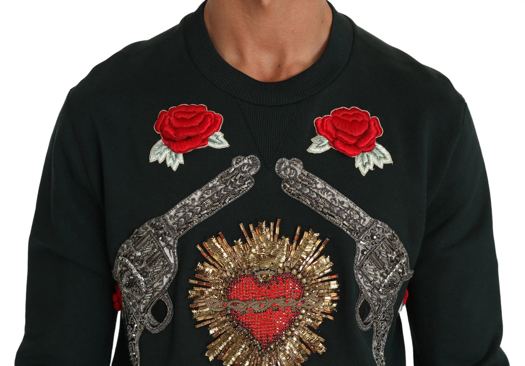 Sweatshirt noir dolce & gabbana avec roses rouges brodées et pistolets argentés entourant un cœur doré pailleté