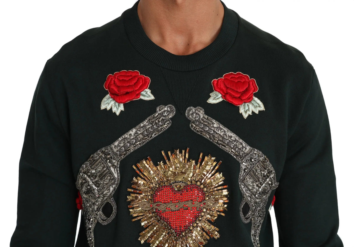 Sweatshirt noir dolce & gabbana avec roses rouges brodées et pistolets argentés entourant un cœur doré pailleté