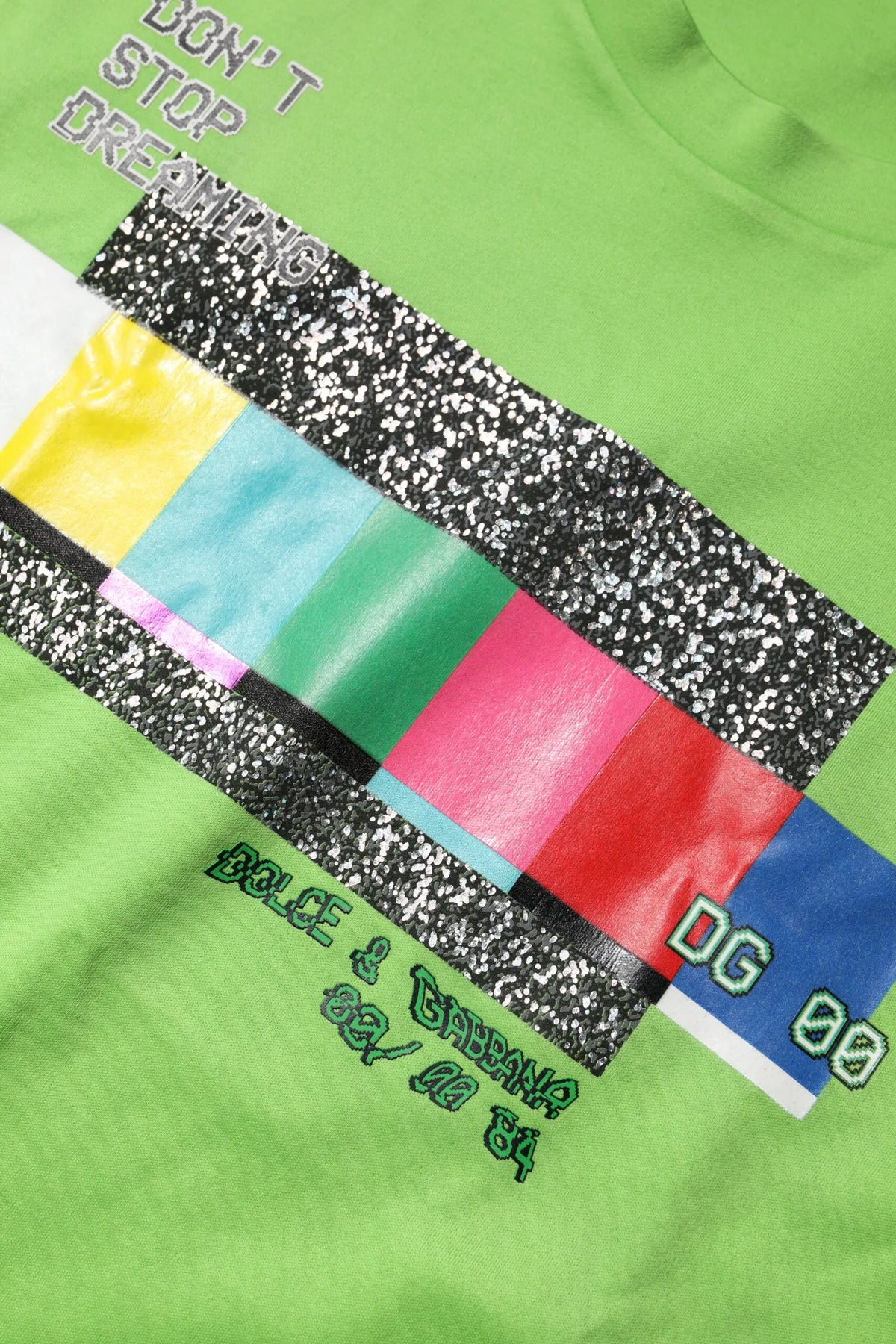 T-shirt vert lime en coton avec motif tv statique coloré et texte ne pas arrêter de rêver signé Dolce & Gabbana