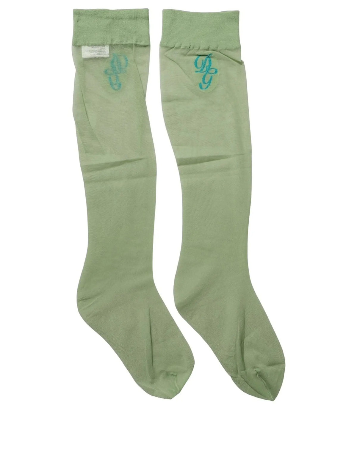 Une paire de chaussettes genou vert clair en nylon transparent dolce & gabbana avec un monogramme teal brodé