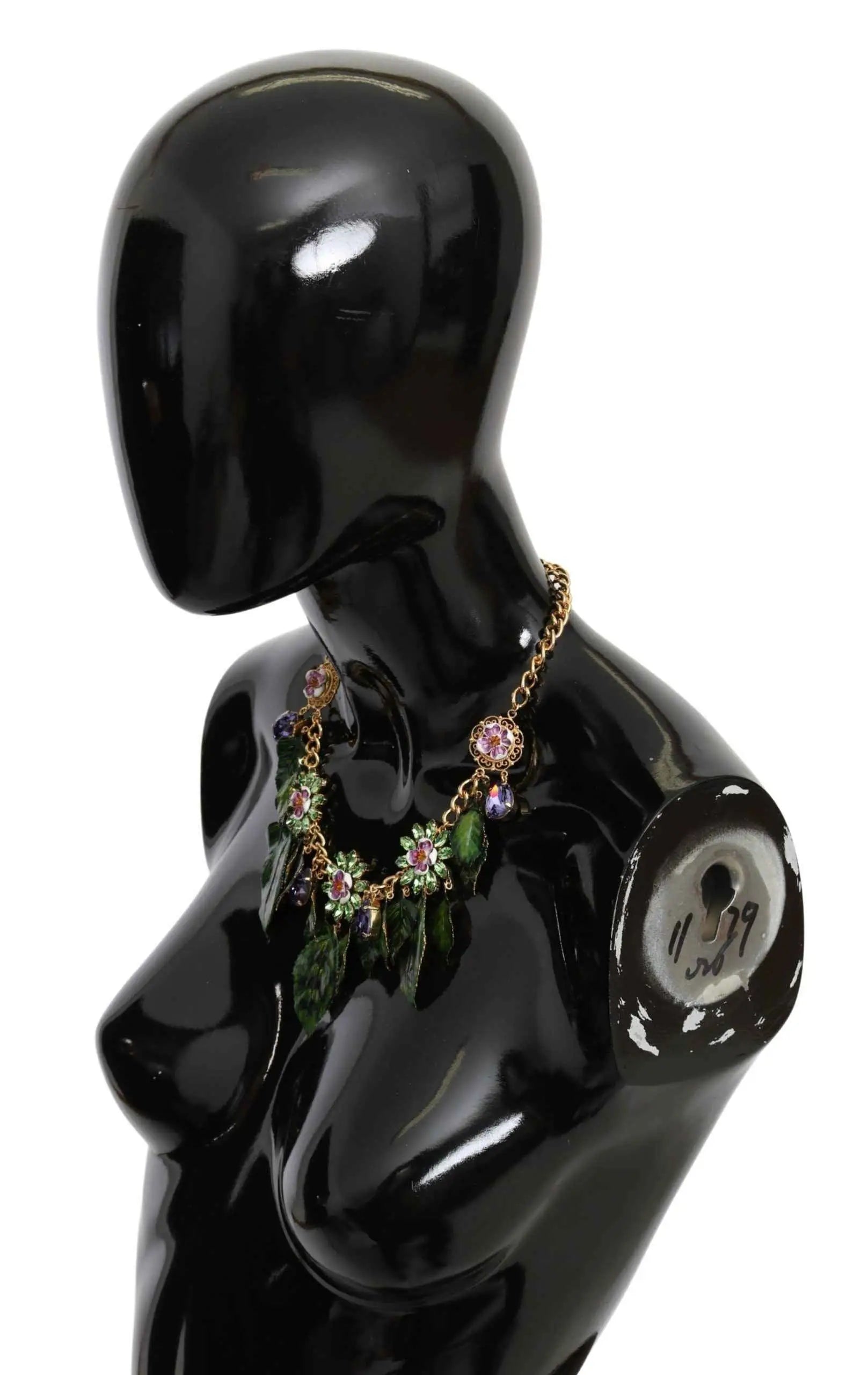 Collier dolce & gabbana en laiton doré avec pendentif floral en cristaux verts et charms feuille pendants