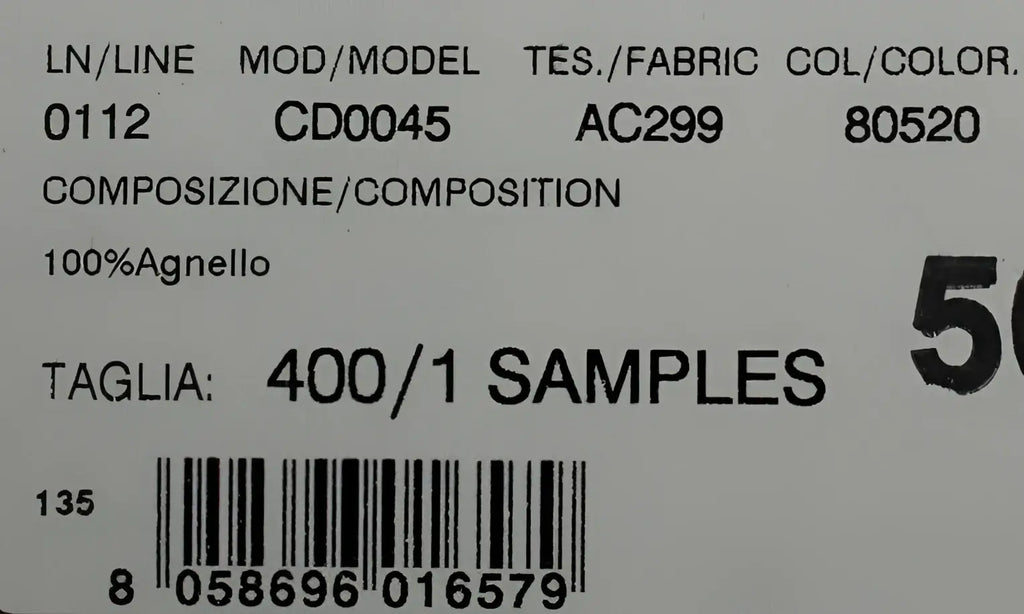 Étiquette en tissu blanc avec texte noir montrant un échantillon 100 pour cent laine pour escarpins vert xiangao en cuir et fourrure dagne dolce & gabbana