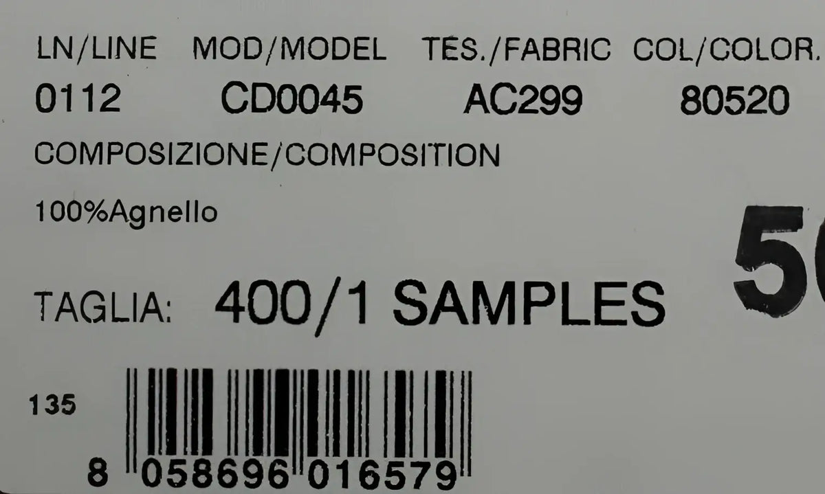 Étiquette en tissu blanc avec texte noir montrant un échantillon 100 pour cent laine pour escarpins vert xiangao en cuir et fourrure dagne dolce & gabbana