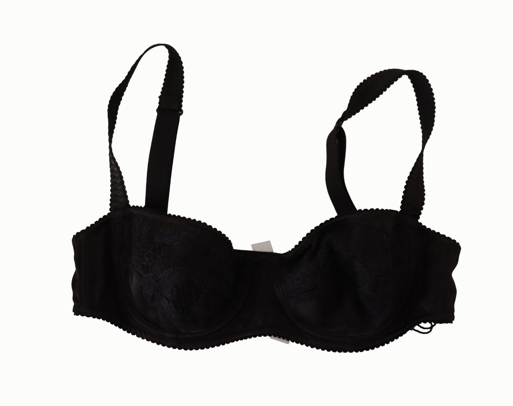 Soutien-gorge balconnet en satin noir à pois blancs avec dentelle, de la marque Dolce & Gabbana, visible en détail.
