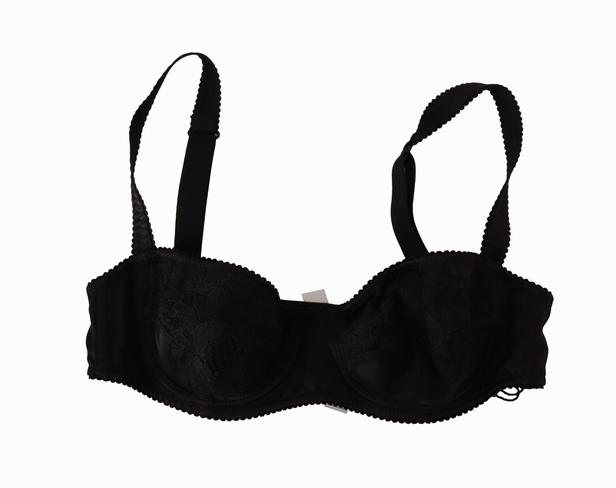 Soutien-gorge balconnet en satin noir à pois blancs avec dentelle, de la marque Dolce & Gabbana, visible en détail.