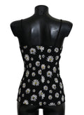 Robe lingerie noire Dolce & Gabbana avec imprimé marguerite, chemisier élégant en tissu léger, visible en gros plan.
