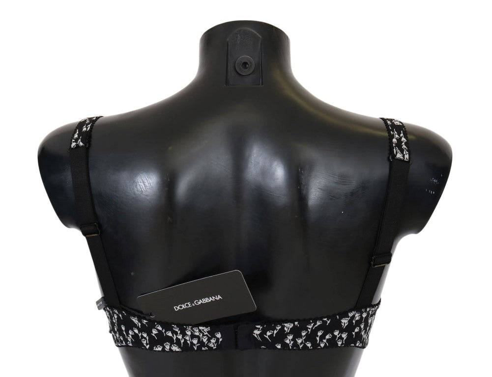 Soutien-gorge en soie noire avec dentelle blanche et élasthanne, marque Dolce & Gabbana, visible en gros plan.
