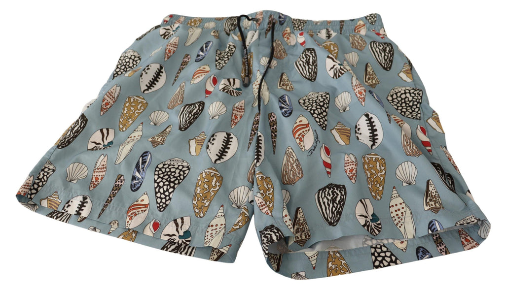 Shorts de bain Dolce & Gabbana Blue Seashell pour plage, tissu léger avec motifs coquillages bleus et blancs.