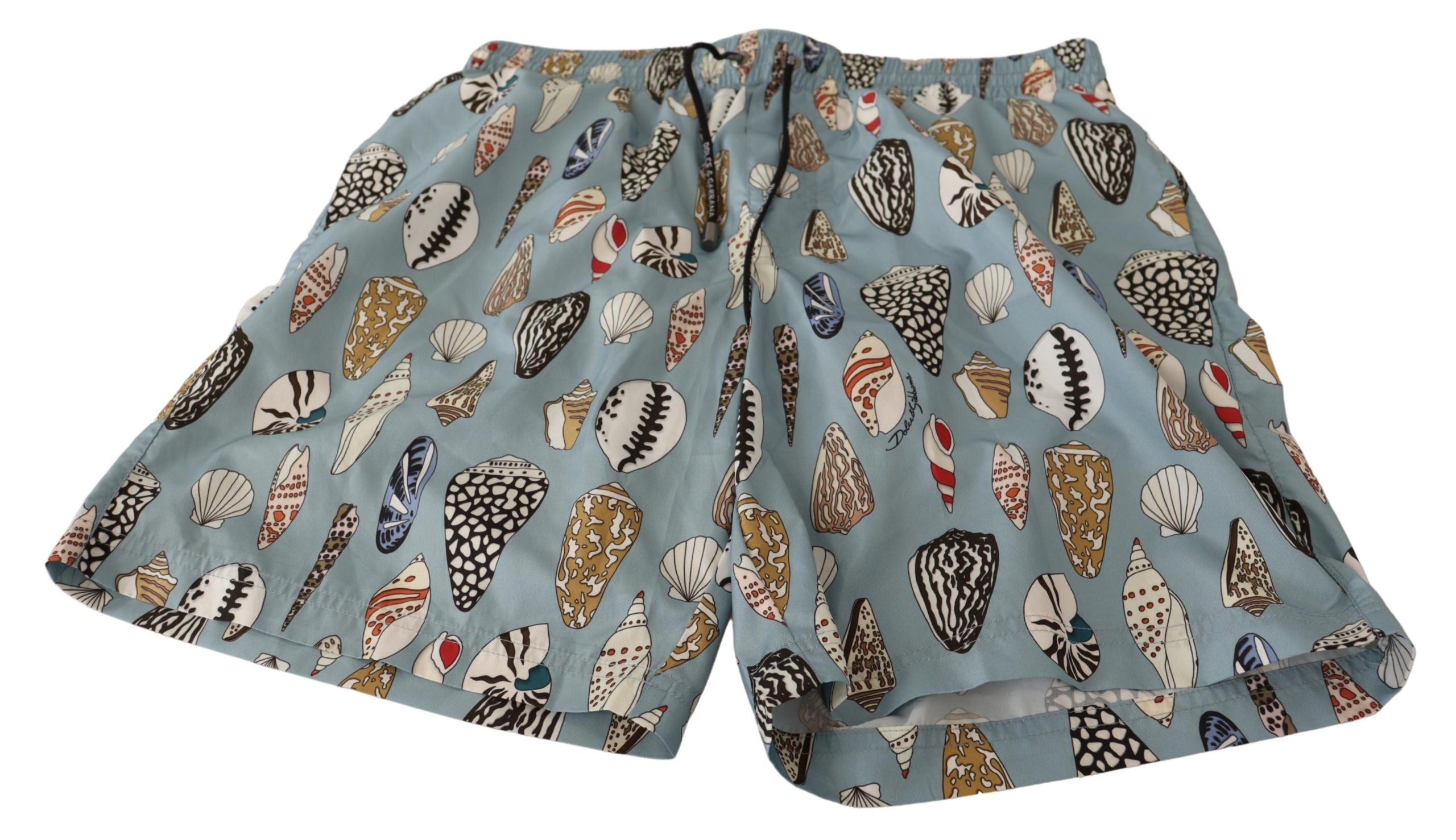 Shorts de bain Dolce & Gabbana Blue Seashell pour plage, tissu léger avec motifs coquillages bleus et blancs.
