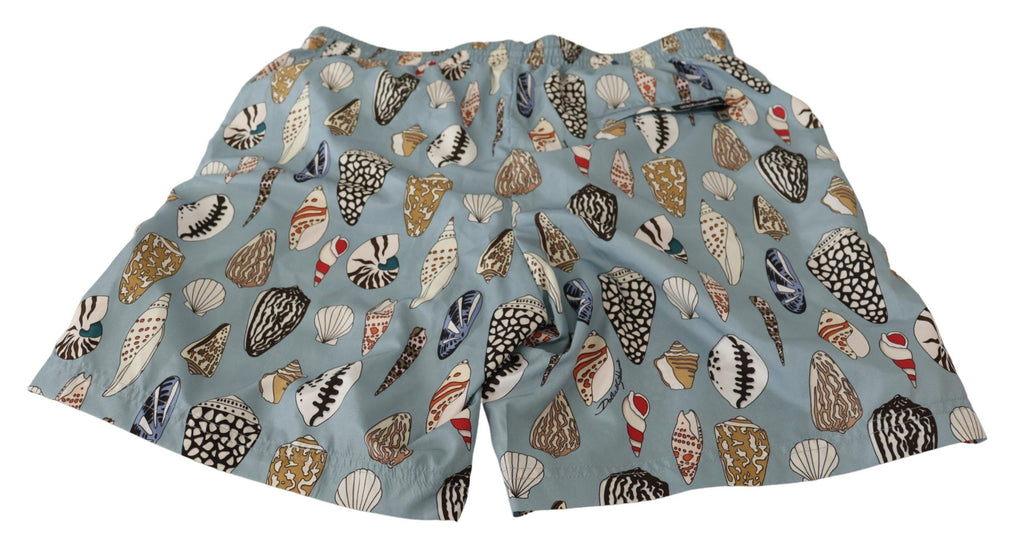Shorts de bain Dolce & Gabbana Blue Seashell, maillot de plage en tissu léger avec motif coquillage bleu.
