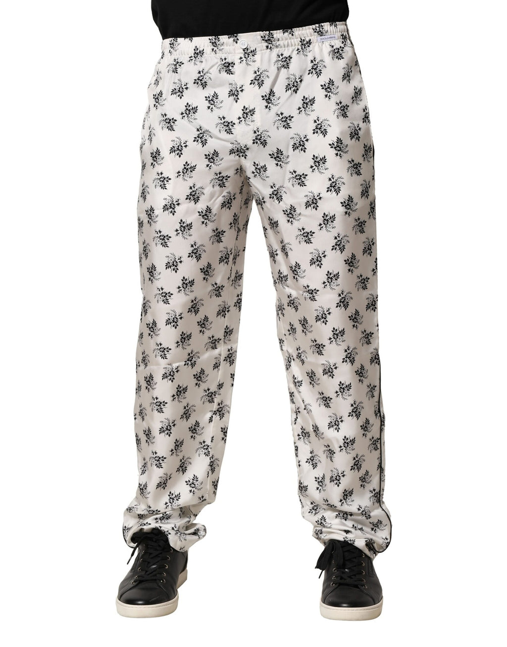 Pantalons décontractés en soie blanche à fleurs de Dolce & Gabbana, style lounge confortable et élégant.