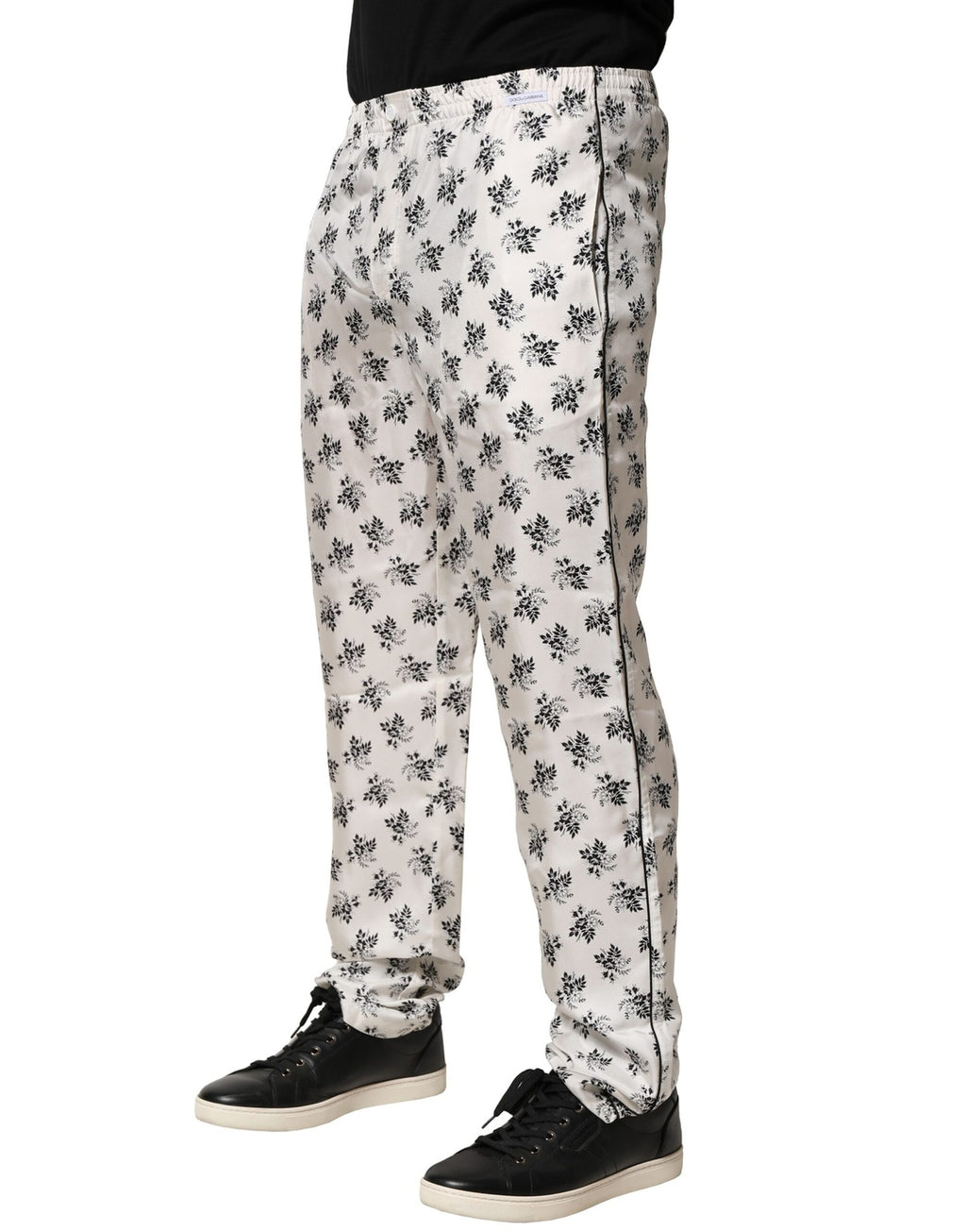 Pantalons décontractés en soie blanche à fleurs de Dolce & Gabbana, style lounge confortable et chic, avec ceinture à cordon.