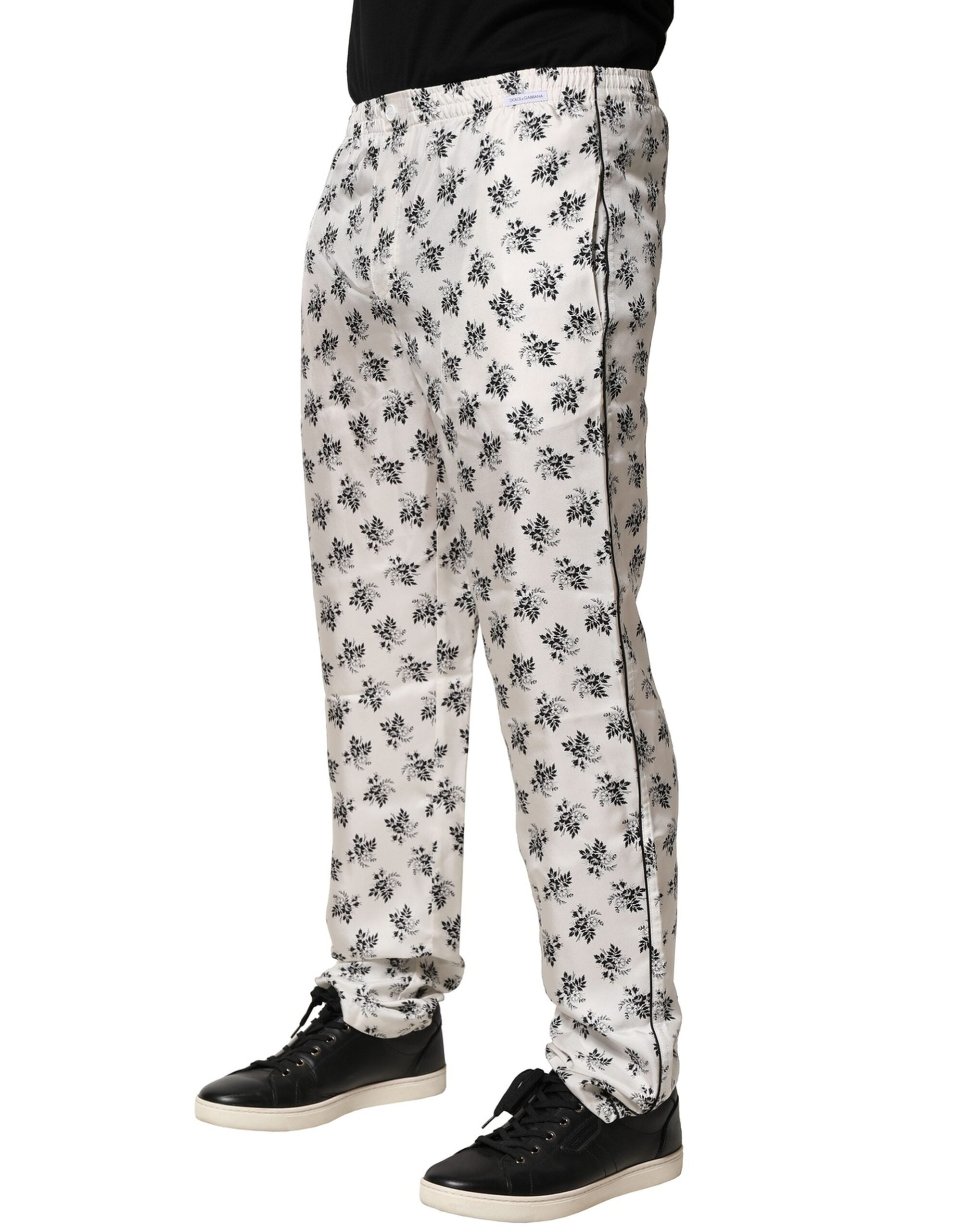 Pantalons décontractés en soie blanche à fleurs de Dolce & Gabbana, style lounge confortable et chic, avec ceinture à cordon.