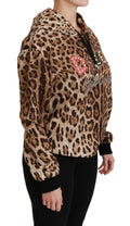 Pull à capuche Dolce & Gabbana marron avec studs et motif léopard, style chaud et tendance.