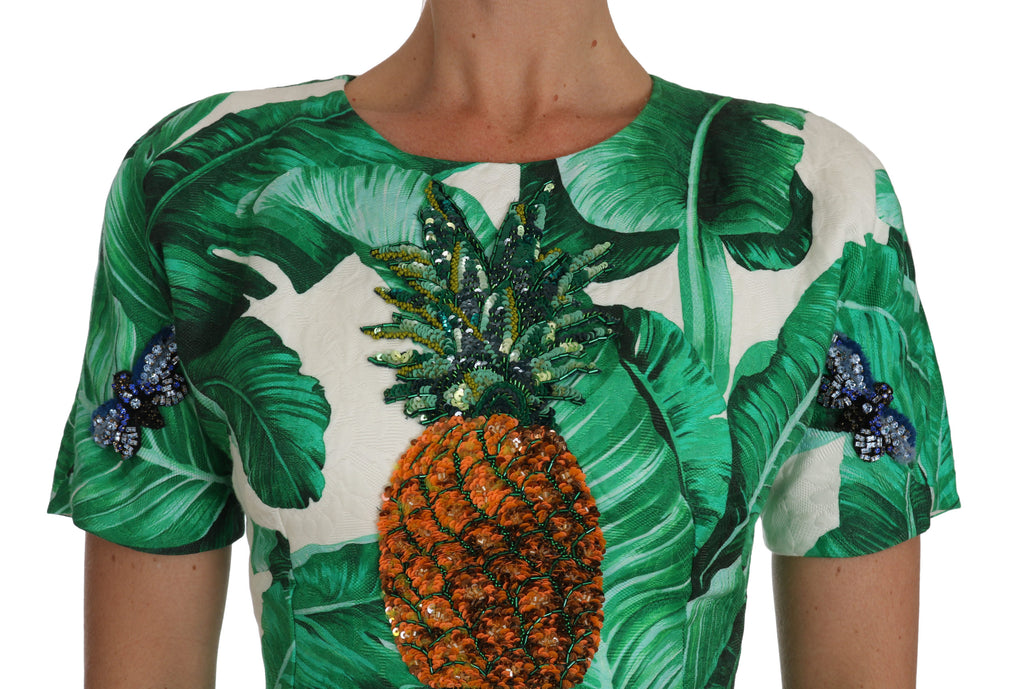 Robe en ligne A Dolce & Gabbana à feuilles de bananier et ananas avec cristaux, élégante et colorée.
