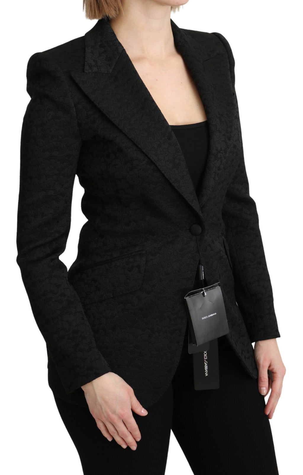 Veste blazer Dolce & Gabbana en brocart noir à un boutonnage simple, élégante et sophistiquée, vue de face.
