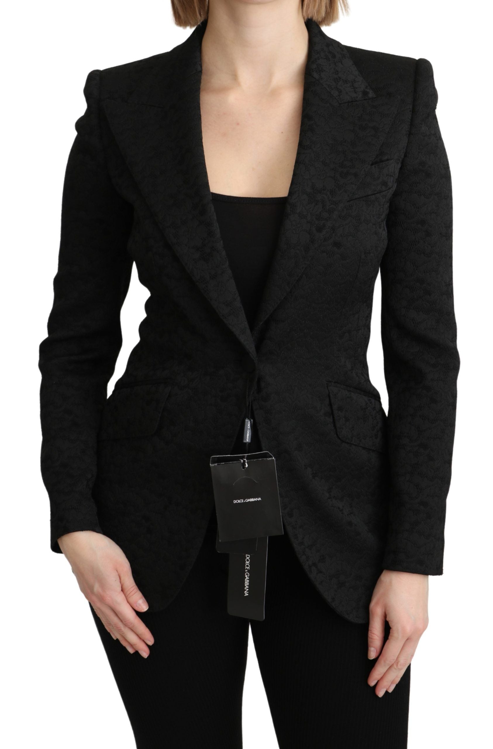 Veste blazer Dolce & Gabbana en brocart noir, à double boutonnage, avec coupe élégante et détails sophistiqués.