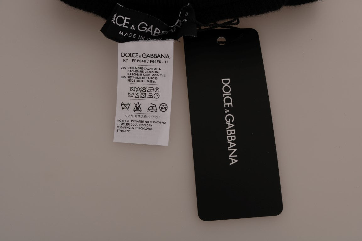 Collants noirs en cachemire et soie de Dolce & Gabbana, tissu extensible, portés avec un look élégant et sophistiqué.