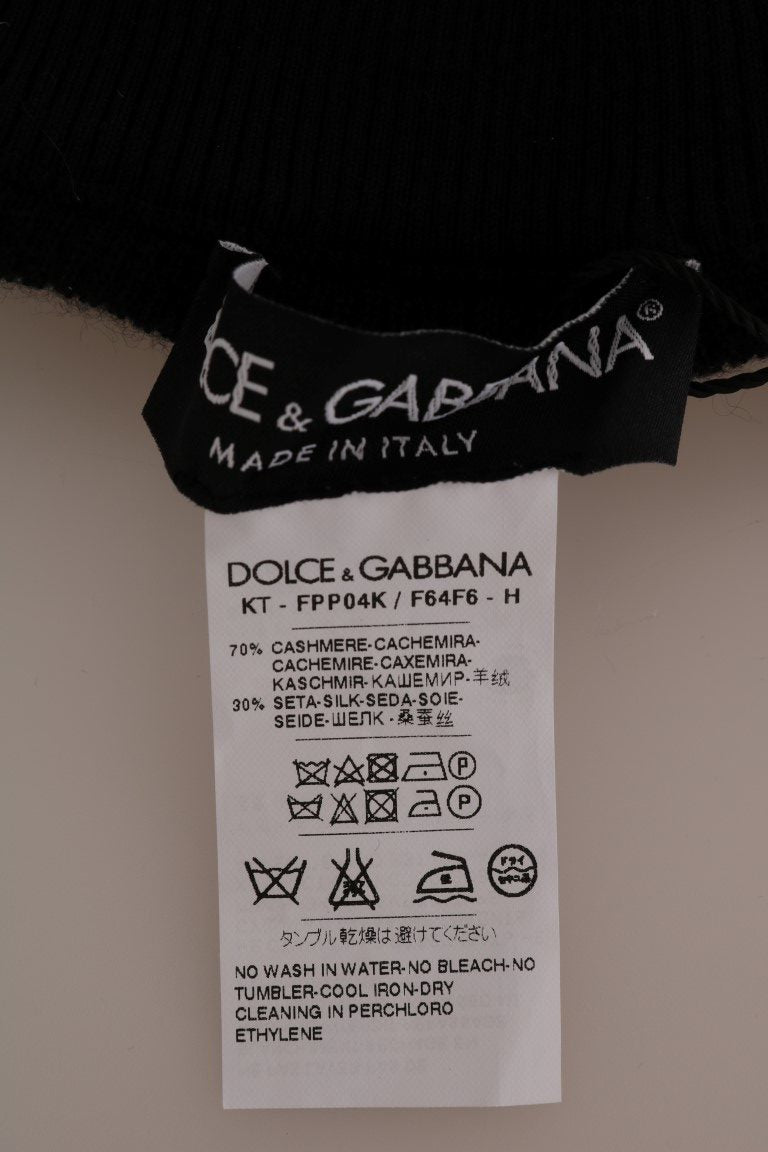 Collants en cachemire et soie noirs Dolce & Gabbana, matière extensible et élégante, portés en bas de silhouette sophistiquée.